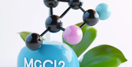 Model cząsteczki na niebieskiej podstawie z napisem MGCL2.